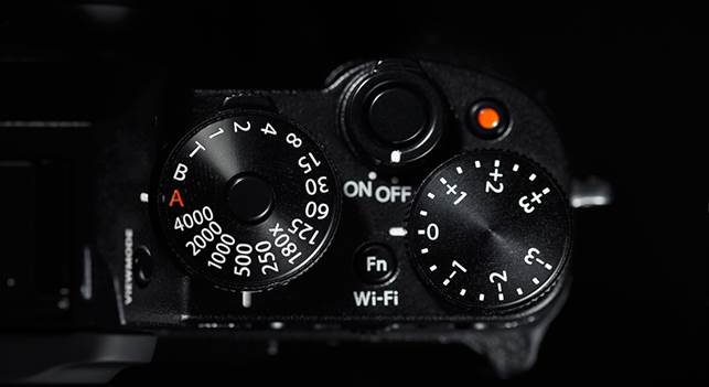 The dials on the left controls the shutter speed, metering type, and exposure compensation