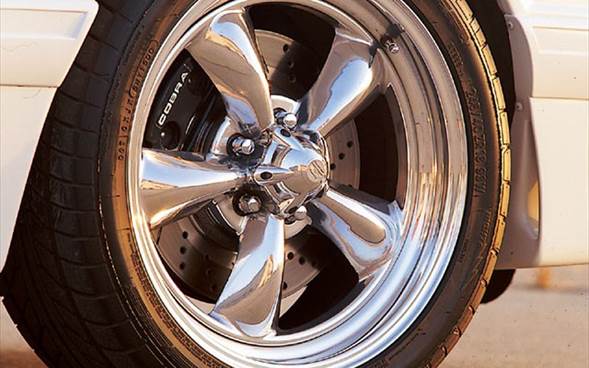 It's hard to beat a good five-spoke wheel in terms of looks, and these replicas of the Saleen design surely qualify. Measuring in at a perfect 18x9 inches, they not only look sweet, but nicely reveal the Cobra discs beneath.