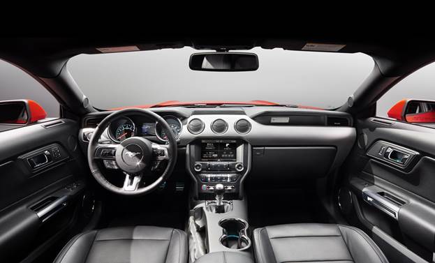The '15 Mustang is now a global car, thus it will be available in right hand-drive variations. The stitched dash trim denotes the upmarket interior package. The wing shaped, double-brow dash is not only stylish, but it frees up about 100mm of extra room thanks to an airbag incorporated in the glovebox door, a Ford first.